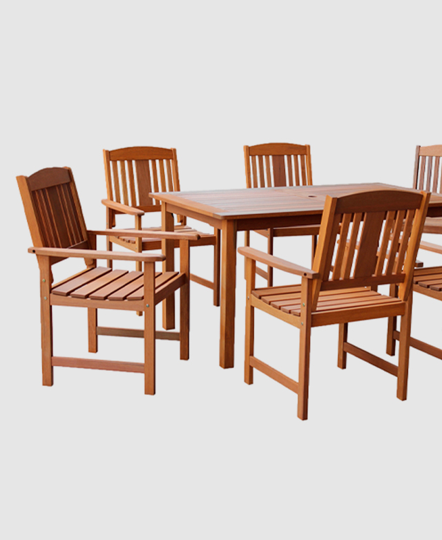 Six timber outdoor dining chairs are positioned at a matching timber table.