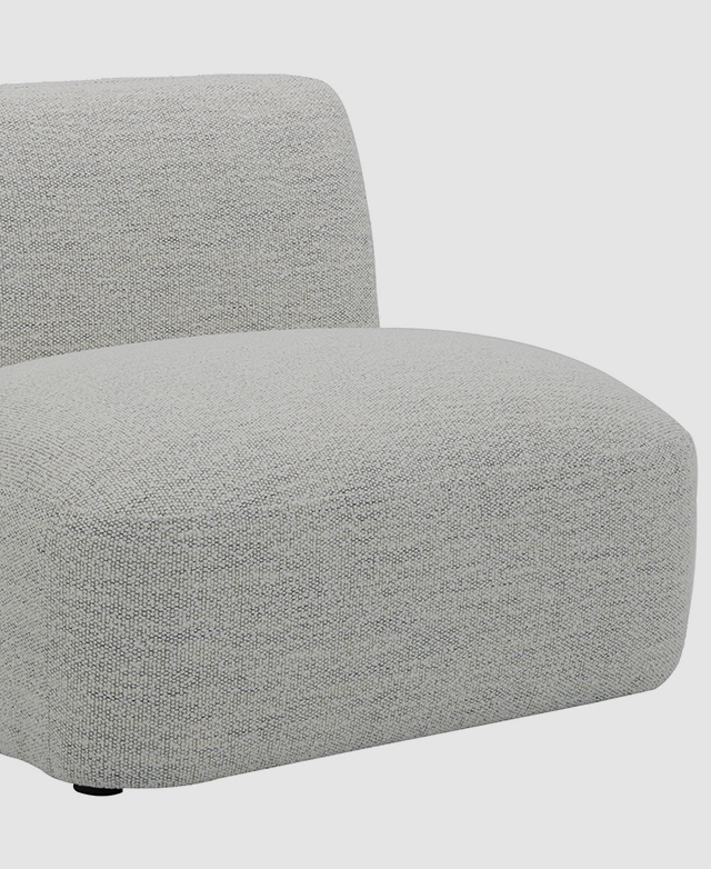 A three-quarter angle highlights the generous width of the open-sided seat