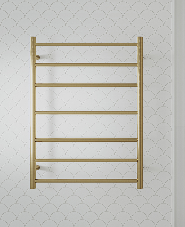 Brushed brass heated towel ladder with multiple bars on white scallop tiled wall.