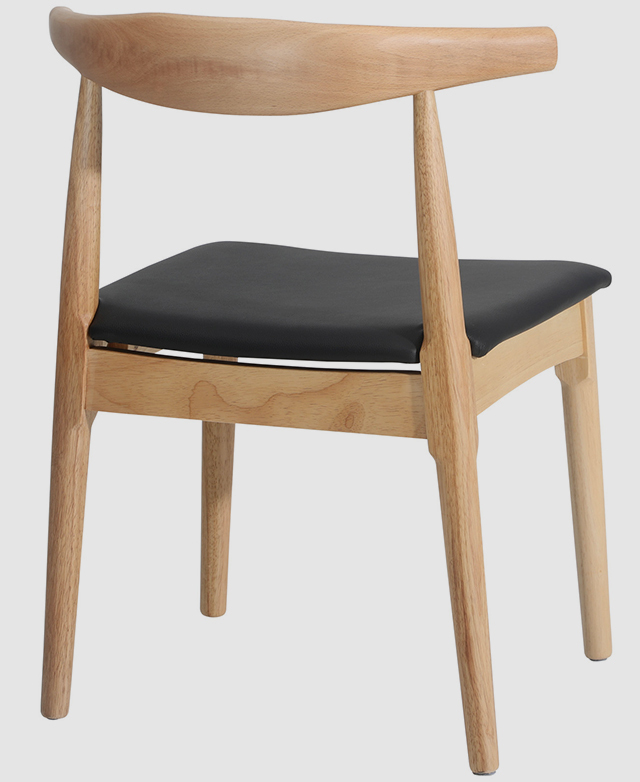 Back view of the chair illuminates the negative space between the backrest and the seat, and showcases the smooth finishes.