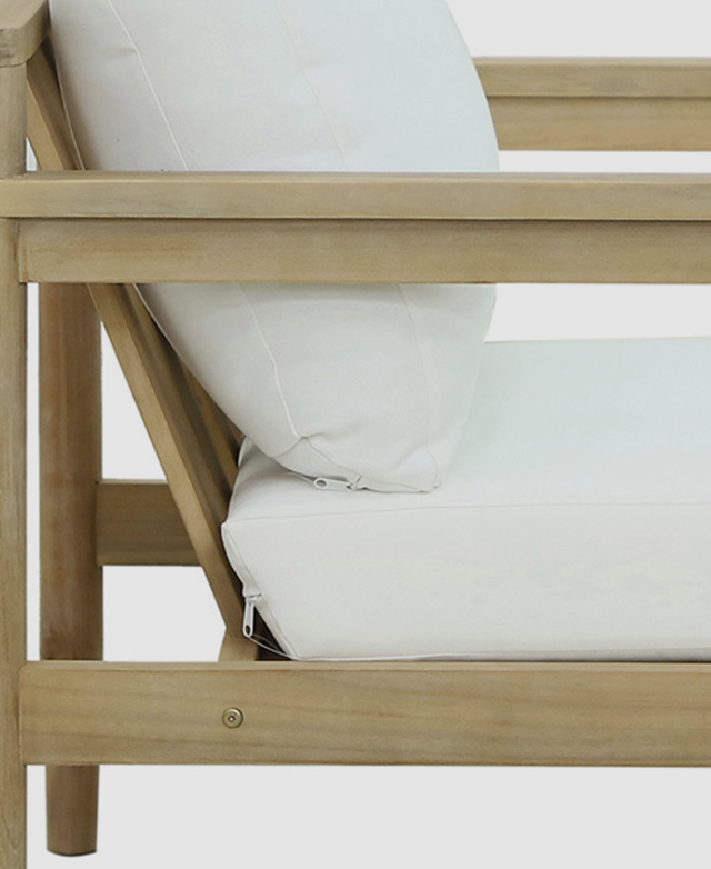 Side view of a chair shows the neat wood frame and the thick, cream seat and back cushions in place, with zips shown. Side view of a chair shows the neat wood frame and the thick, cream seat and back cushions in place, with zips shown.