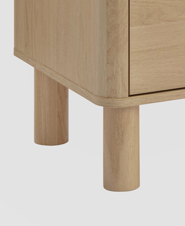 Two of the thick cylindrical pine wood legs are in focus. Two of the thick cylindrical pine wood legs are in focus.