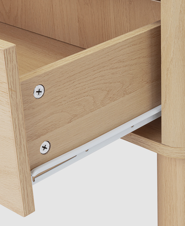 One of the drawers is presented at an angle, fully open, to display a white metal runner. One of the drawers is presented at an angle, fully open, to display a white metal runner.