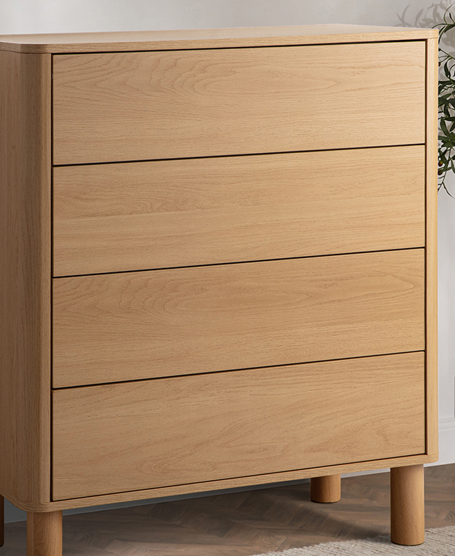 The laminated surfaces of the tallboy have the appearance of wood with sweeping grain patterns. The laminated surfaces of the tallboy have the appearance of wood with sweeping grain patterns.