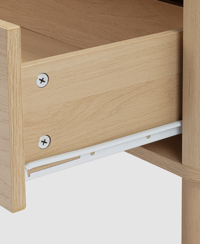 One of the drawers is presented at an angle, partially open, to display a white metal runner. One of the drawers is presented at an angle, partially open, to display a white metal runner.