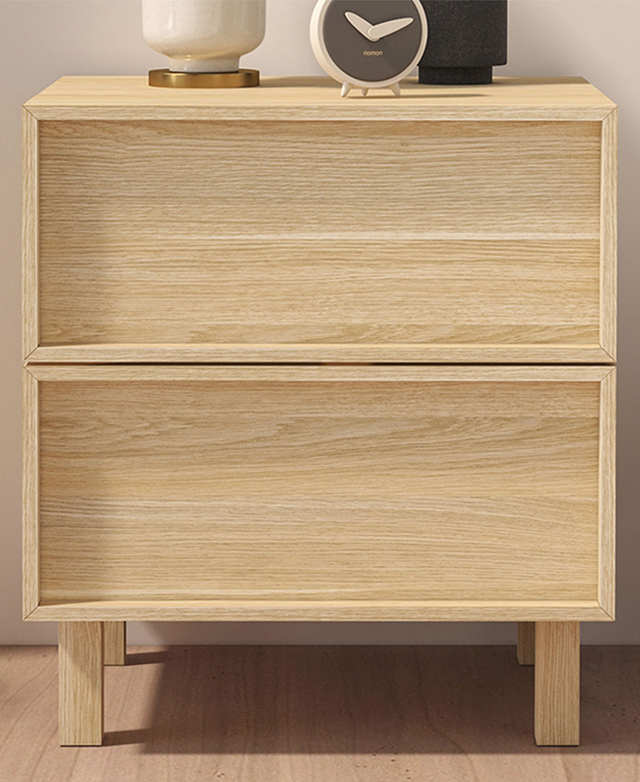 The front of the bedside table is in focus to display the shaker-style drawer finishes. The front of the bedside table is in focus to display the shaker-style drawer finishes.
