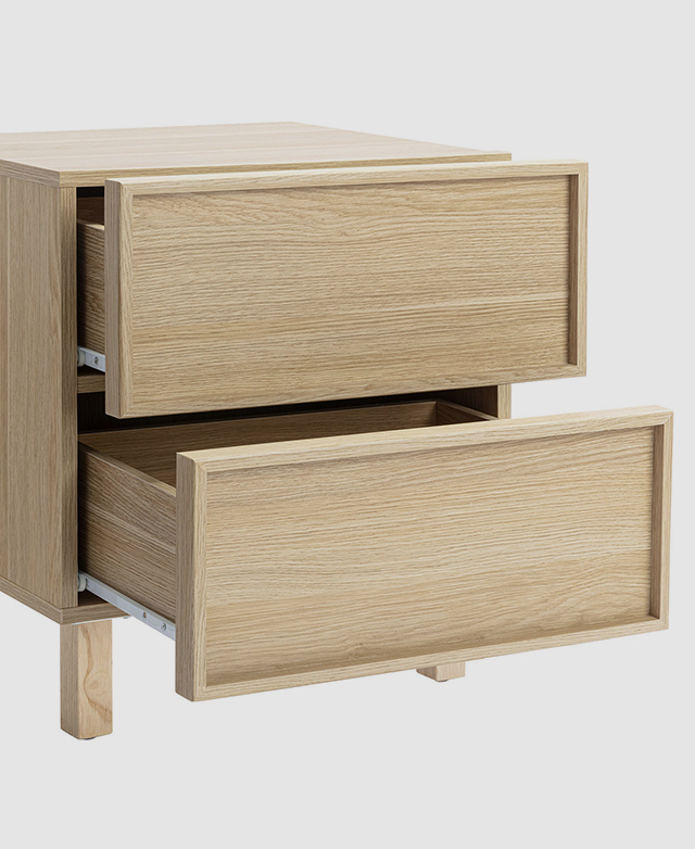 Bedside table with shaker fronts with both drawers partially open. Bedside table with shaker fronts with both drawers partially open.