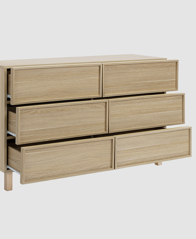 Chest of drawers with shaker fronts with all six drawers partially open. Chest of drawers with shaker fronts with all six drawers partially open.