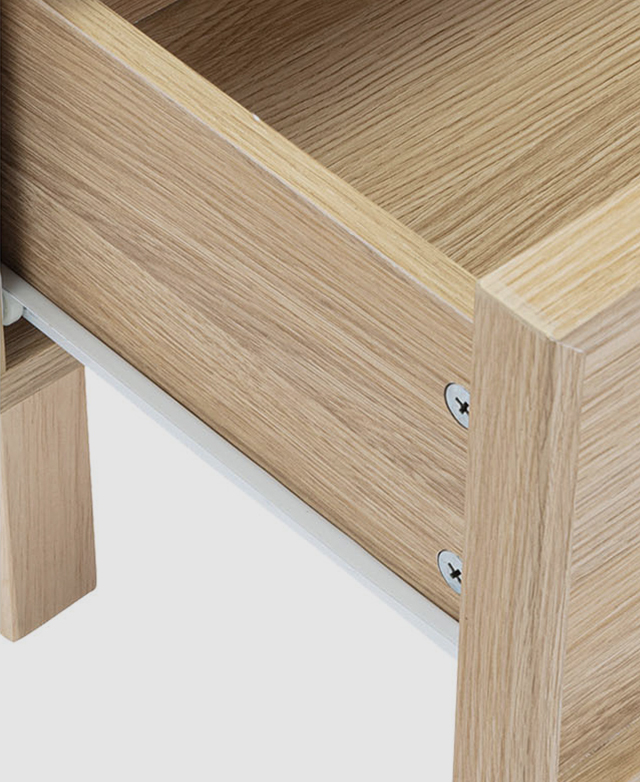 Bird's-eye view of a single drawer partially open shows a white metal runner. Bird's-eye view of a single drawer partially open shows a white metal runner.