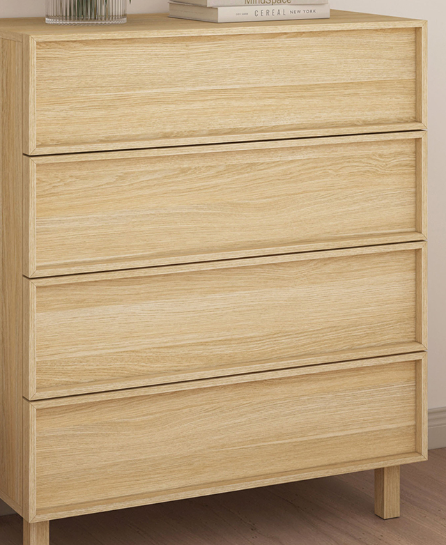 The front of the chest of drawers is in focus to display the shaker-style drawer finishes.