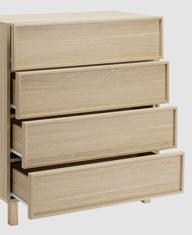 Chest of drawers with shaker fronts with all four drawers partially open.