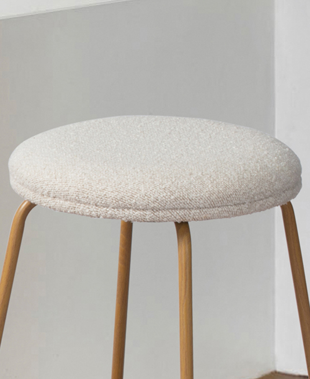 Oblique angle demonstrates the depth of the cream stool's seat.