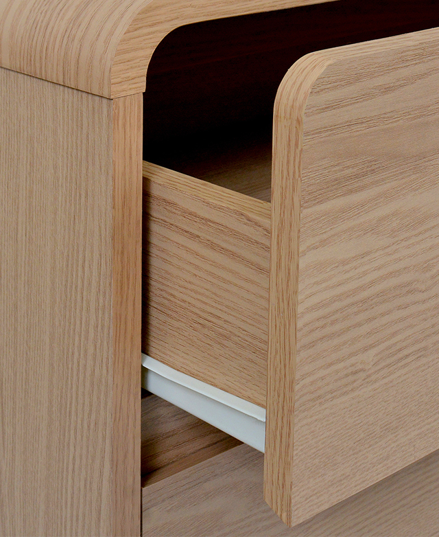 Three-quarter view of an open drawer draws attention to the white iron runner. Three-quarter view of an open drawer draws attention to the white iron runner.