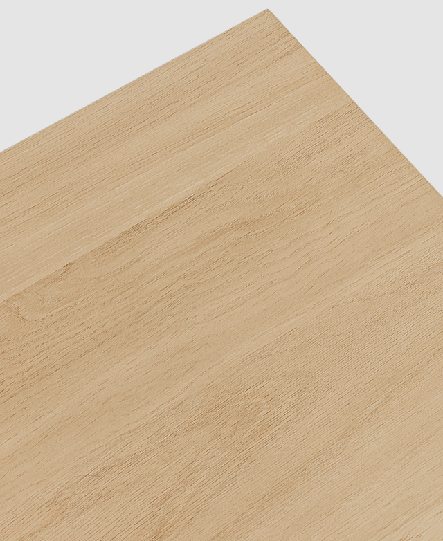 A close, bird's eye view of the top surface of the entertainment unit presents the grainy wood-look finish of the laminate. A close, bird's eye view of the top surface of the entertainment unit presents the grainy wood-look finish of the laminate.