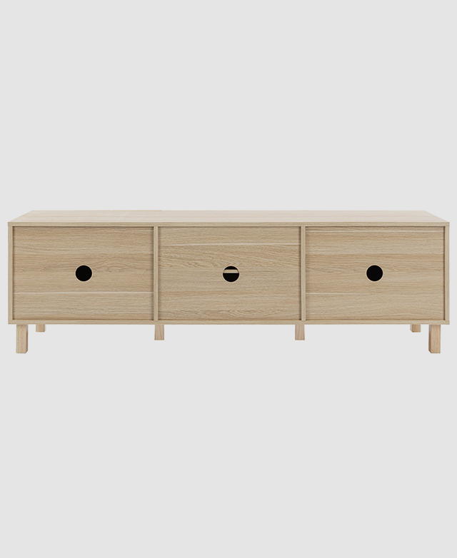 A back view of the entertainment unit spotlights the three cable holes. A back view of the entertainment unit spotlights the three cable holes.
