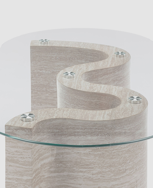 A top-down view of the coffee table displays its oval shape and the wavy stone-look base beneath. A top-down view of the coffee table displays its oval shape and the wavy stone-look base beneath.