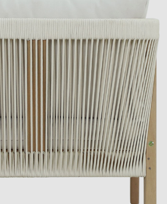 A back view of the armchair displays the woven cream rope backrest.