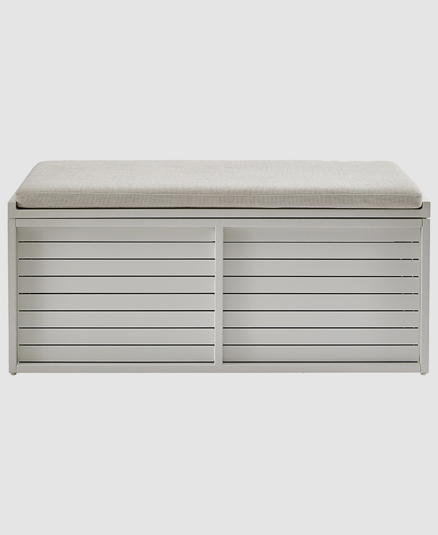 Front-facing view of the grey outdoor bench highlights the slatted body and cushioned seat.