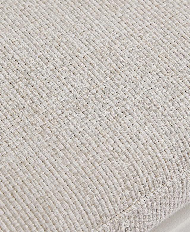 Close-up of the seat cushion draws attention to the light grey woven fabric.