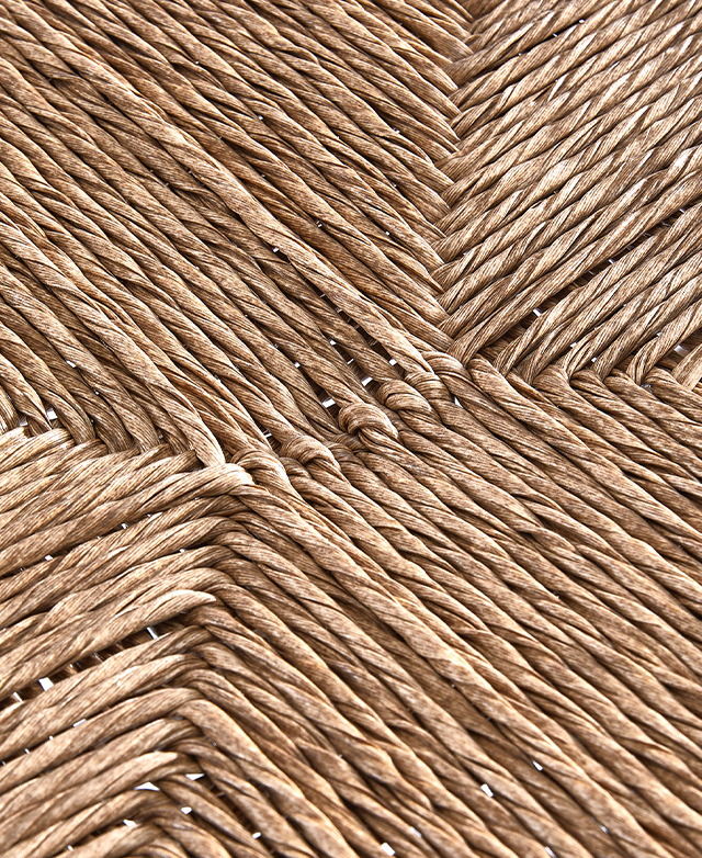 Polyethylene wicker with an aged look is exhibited close up.