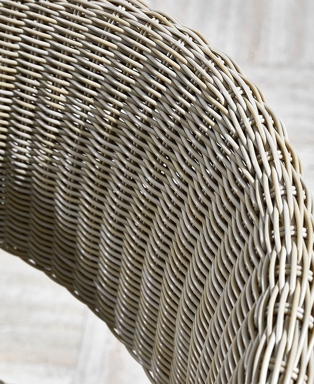 The gently curved backrest is made from smoothly woven polyurethane in a light grey tone.