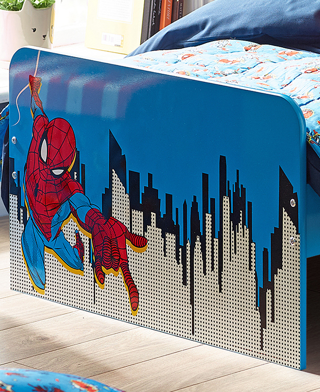 The bed's footend has a glossy finish over a scene that illustrates a swinging spiderman over a cityscape.