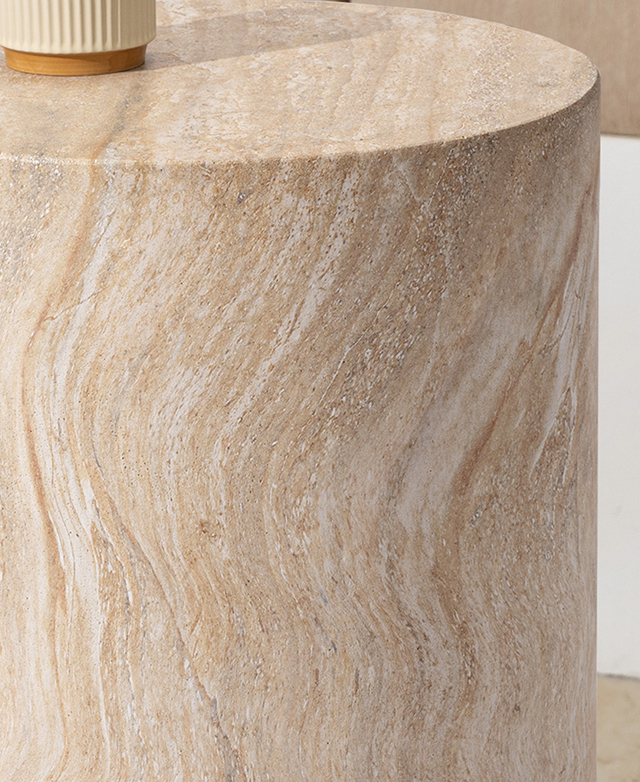 The peachy-coloured polystone is presented up close to highlight the vein effect and smooth surfaces. The peachy-coloured polystone is presented up close to highlight the vein effect and smooth surfaces.