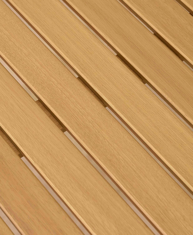 A cropped, bird's eye view of the dining table emphasises the slatted top.
