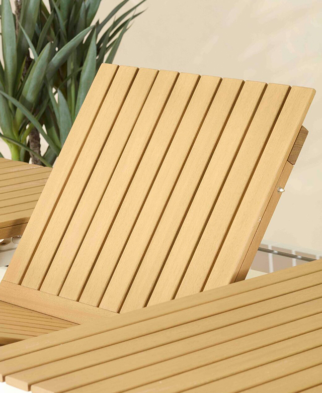The central butterfly table panels are partially lifted as the table is extended.