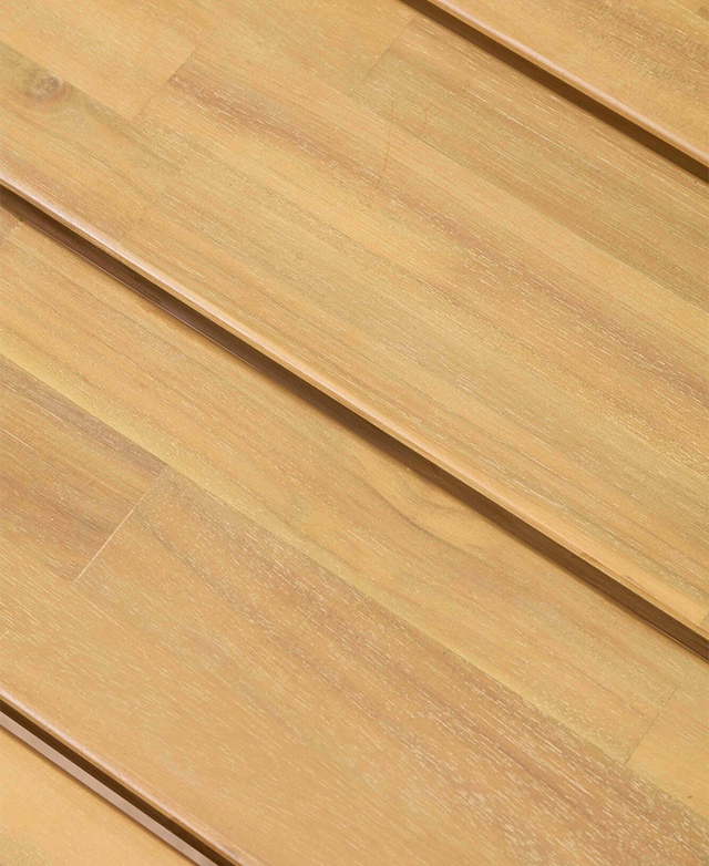 A cropped, bird's eye view of the wooden coffee table emphasises the slatted top and rich, golden hue.