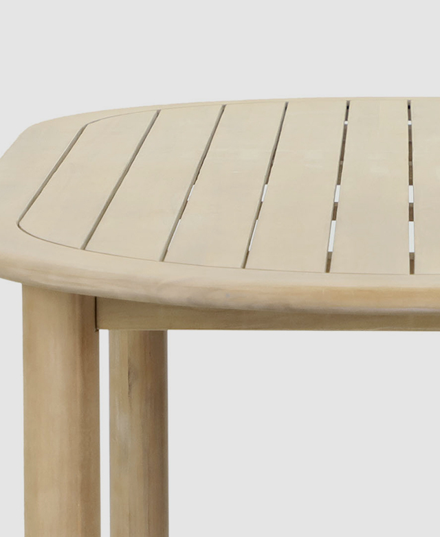 A side view of the dining table shows the slatted top, chunky and stable legs, and the light timber finish.