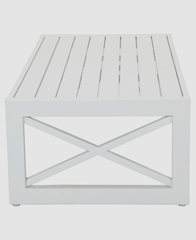 The white, rectangular coffee table is shown from one end, highlighting the slatted top and the cross brace.