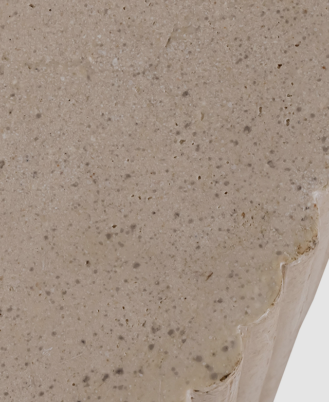 A bird's eye view of the cast stone coffee table highlights the speckles and the soft colour variances. A bird's eye view of the cast stone coffee table highlights the speckles and the soft colour variances.