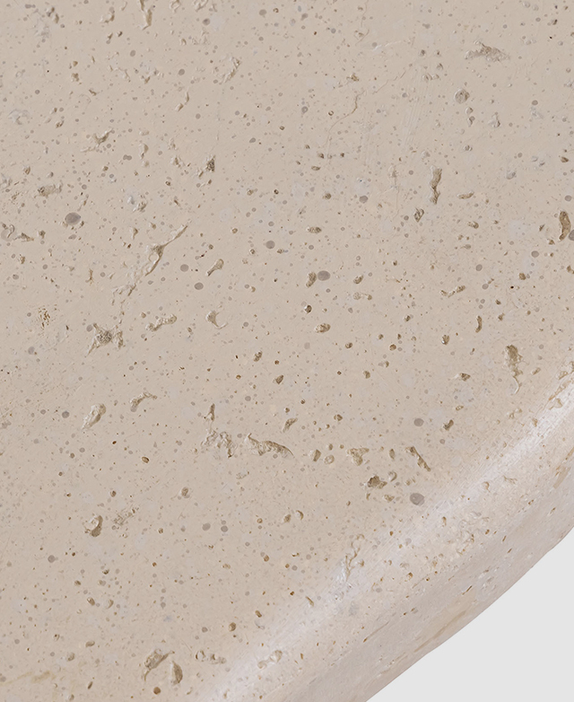 A bird's eye view of the stone side table highlights the speckles and the soft colour variances. A bird's eye view of the stone side table highlights the speckles and the soft colour variances.