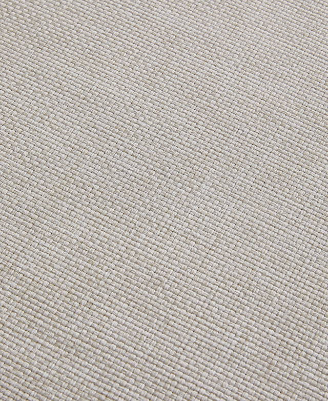 Magnified perspective of the off-white, woven Olefin upholstery. Magnified perspective of the off-white, woven Olefin upholstery.