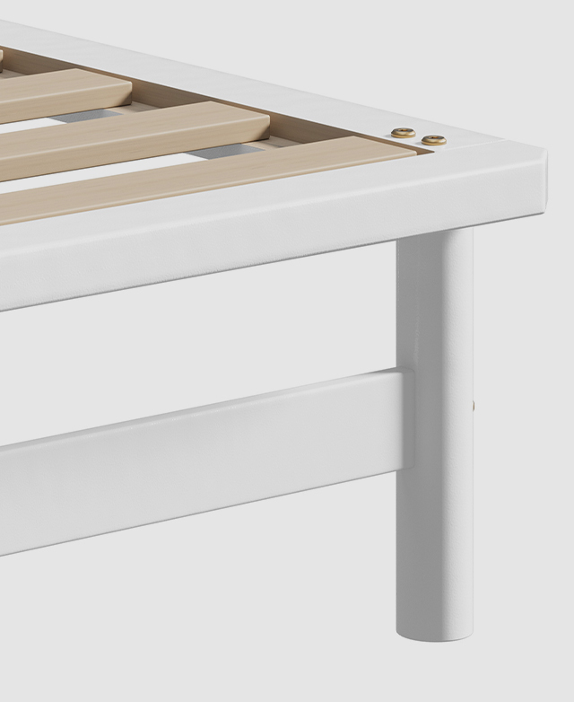 The thick white bed frame is made with pine wood; a corner is shown to be chamfered to remove its sharpness. The thick white bed frame is made with pine wood; a corner is shown to be chamfered to remove its sharpness.
