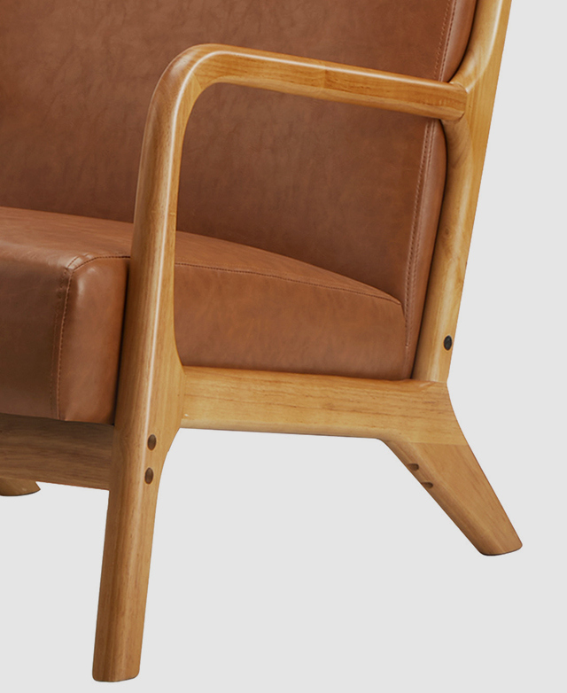 A three-quarter view of the armchair focuses on the smooth, slender rubberwood armrest and frame.