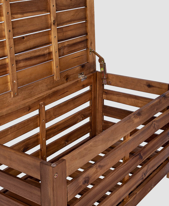 The lid of the timber storage box is lifted on metal hinges.