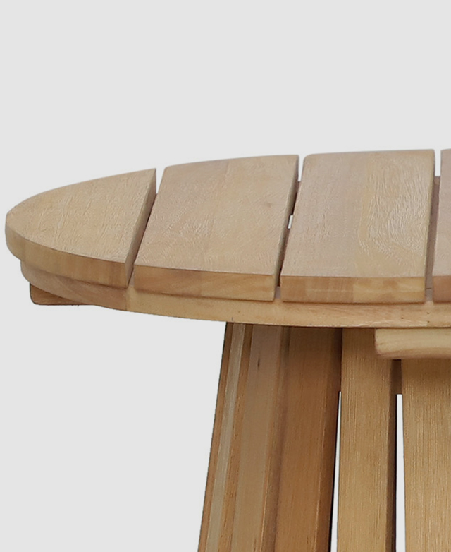 A cropped view of the side table highlights the smoothly-finished edges of the panels of wood that make up the surface. A cropped view of the side table highlights the smoothly-finished edges of the panels of wood that make up the surface.