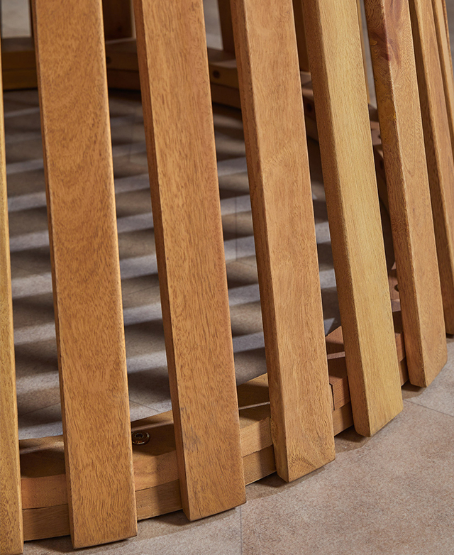 The vertical slatting of the eucalyptus wood base is captured close up to show its rich, warm hue and natural grains.