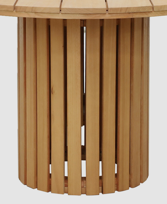 One end of the table is captured to highlight the pillar design and its vertical slatting.