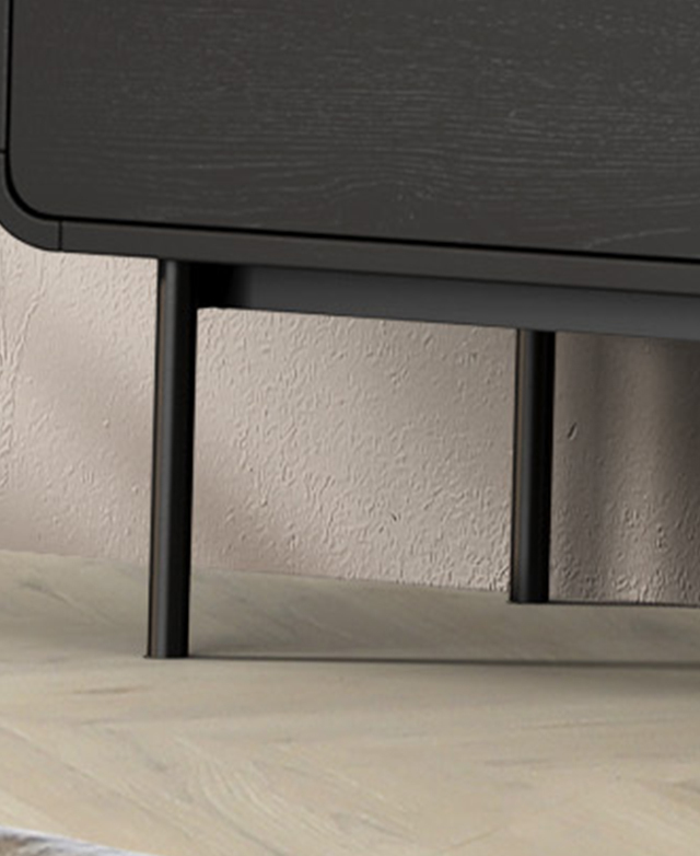 The black base and slender, cylindrical legs are made from powder-coated iron.