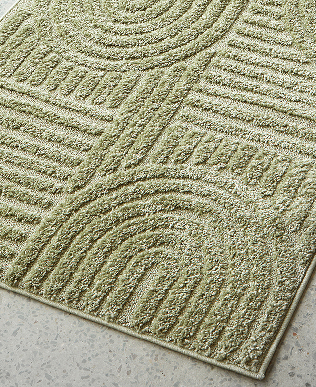 A cropped view shows the pistachio runner's geometric, tonal pattern and its high-low texture.