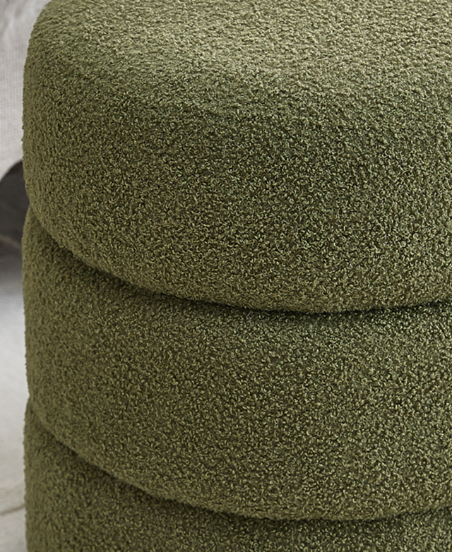 Close up of the green boucle fabric highlights its soft, nubby texture. Close up of the green boucle fabric highlights its soft, nubby texture.