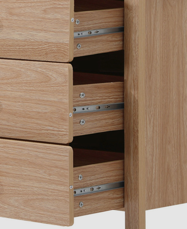 Three drawers are open and shown from a three-quarter view to highlight the silver metal runners.
