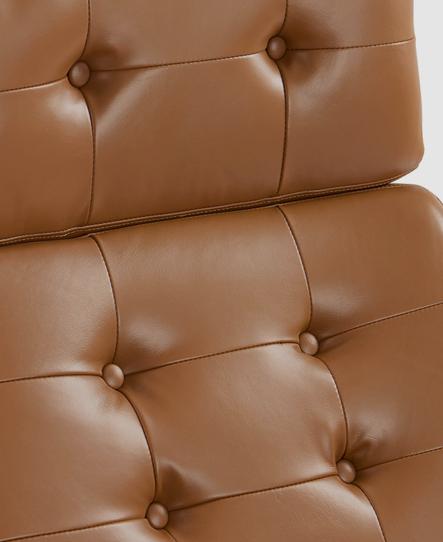Button tufting adds visual texture to the tan upholstery.