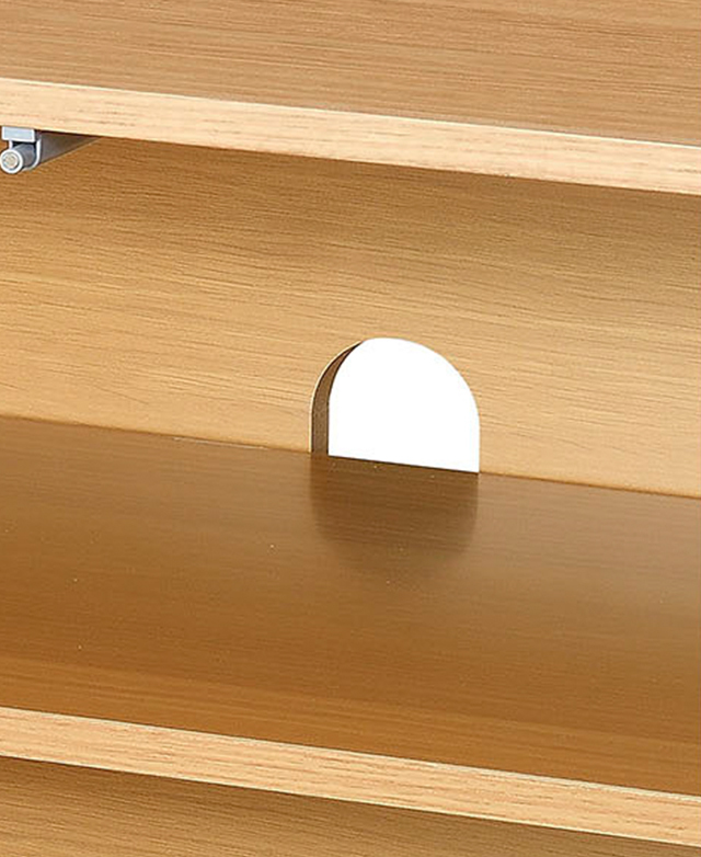 The inside of the TV unit zooms in on the cable hole at the back, which is designed for neat cable management.