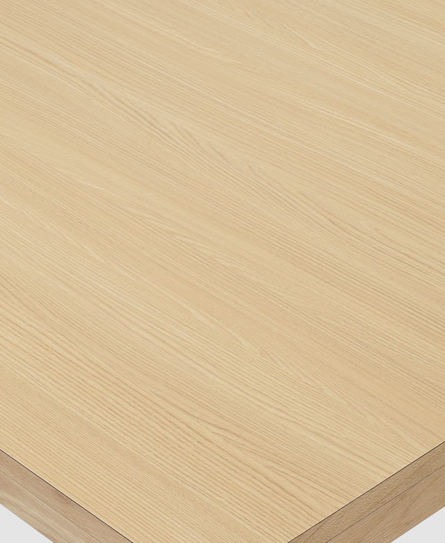Close up of the dining table's surface shows its uniform pattern and smoothness. Close up of the dining table's surface shows its uniform pattern and smoothness.