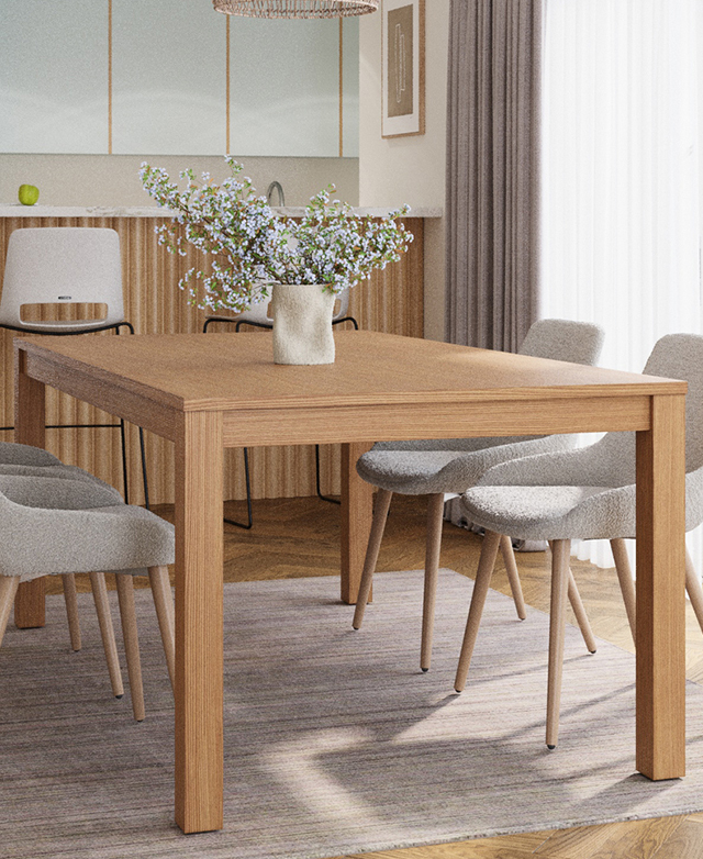 Rectangular dining table and four upholstered chairs on a taupe rug in a dining room. A vase of pretty flowers is on top. Rectangular dining table and four upholstered chairs on a taupe rug in a dining room. A vase of pretty flowers is on top.