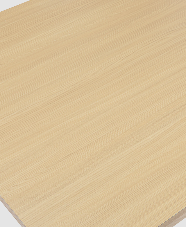 Close up of the dining table's surface shows its uniform pattern and smoothness. Close up of the dining table's surface shows its uniform pattern and smoothness.